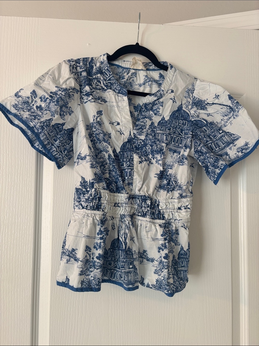Umgee Blue and White Toile Print Smocked Waist Flutter Sleeve Peplum Top